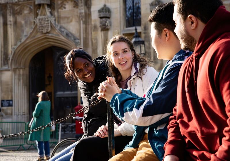 A group of Cambridge University students are sitting in front of King's College on King's Parade in central Cambridge. Copyright University of Cambridge (November 2024)