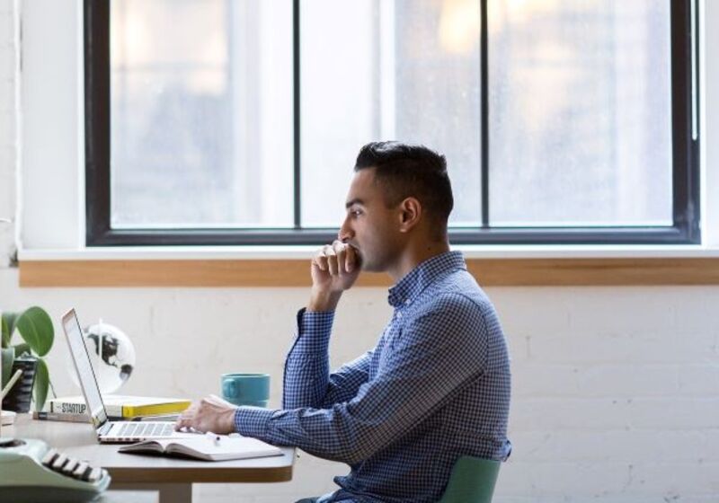 Man working at a laptop Image by SnapStock from Pixabay.