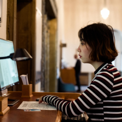 A University of Cambridge student is using a computer to search a library catalogue for books at the Cambridge University Library. Credit: Alice the Camera/Cambridge University Library