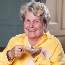 Sandi Toksvig holding a world map marble in Darwin’s room at Christs college Cambridge. photo credit Graham Copekoga