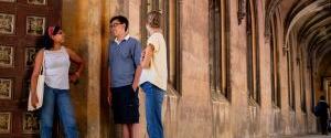 University of Cambridge students standing and talking at the St John's College Eagle Gate and New College Cloisters. Copyright: University of Cambridge (June 2023)